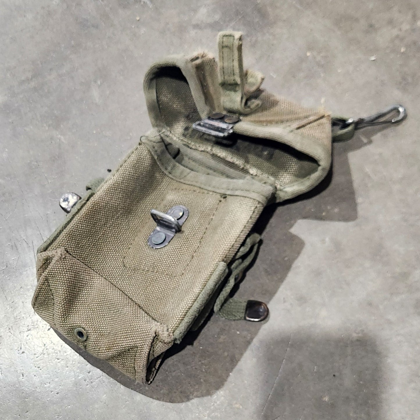 Beige pouch on a concrete surface
