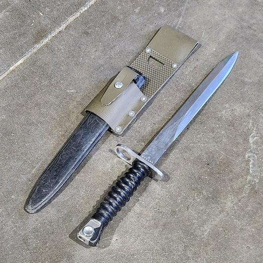 Two swords on a concrete floor