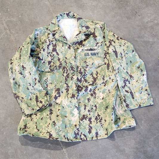 Camouflage-patterned fabric on a concrete floor