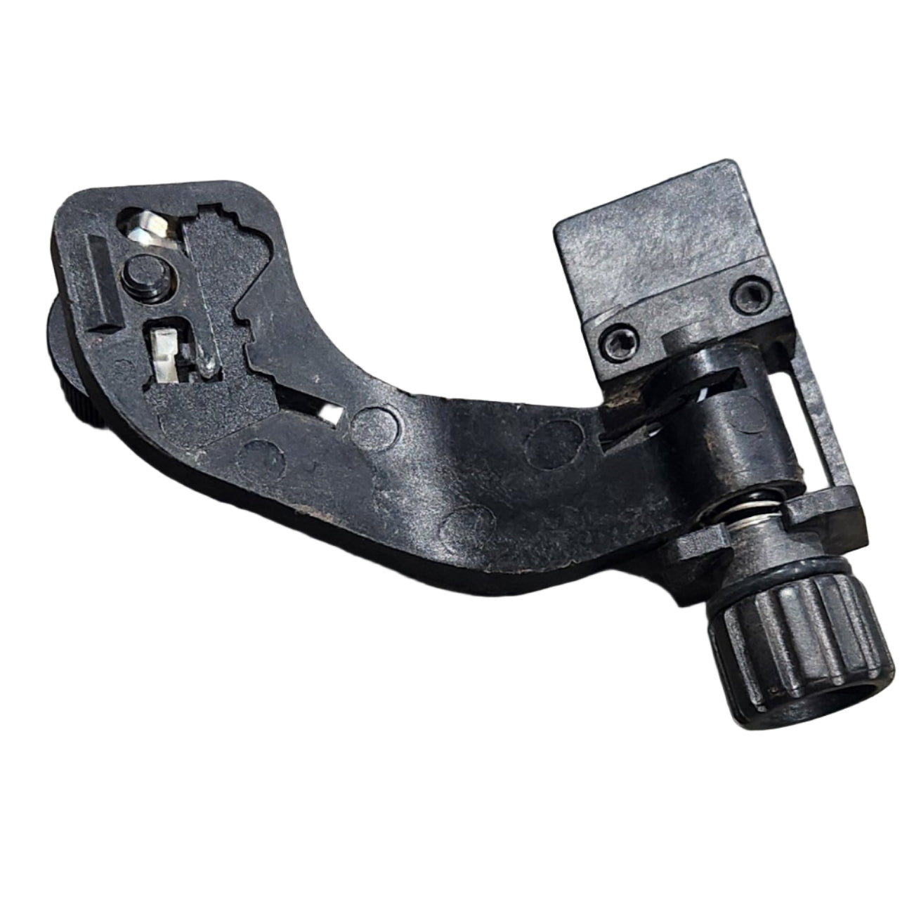 Black metal lever or handle on a gray surface