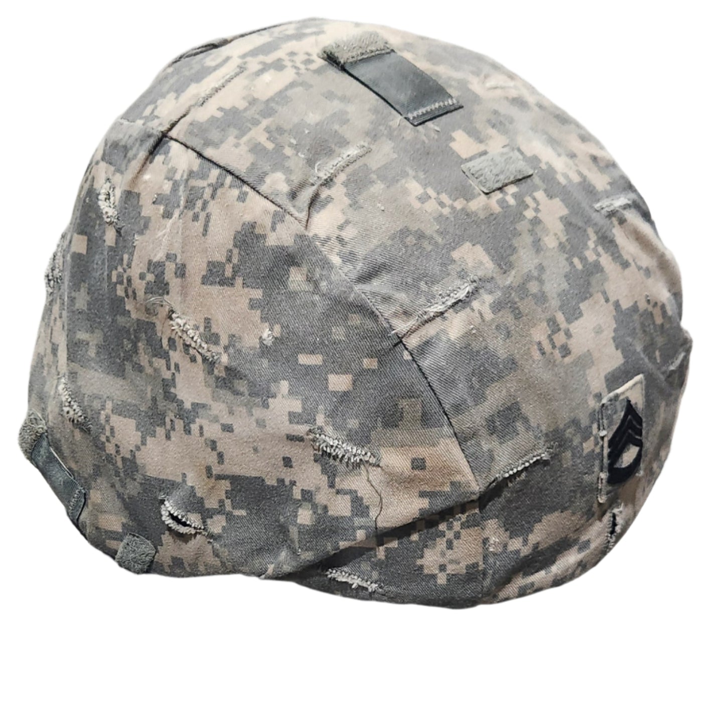 Camouflage helmet on a concrete floor