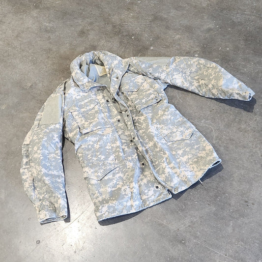 UCP M65 Jacket on a concrete floor