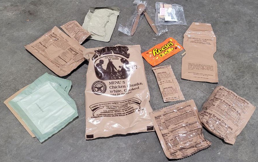 Collection of vintage-style food packages and a small box on a gray surface