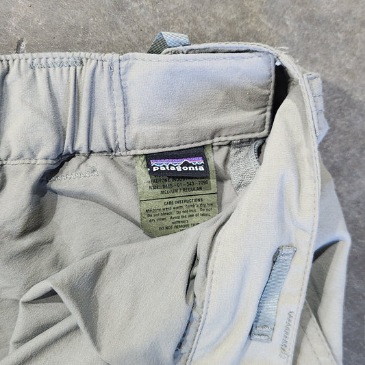 Light-colored denim jacket with a brand label on a concrete surface