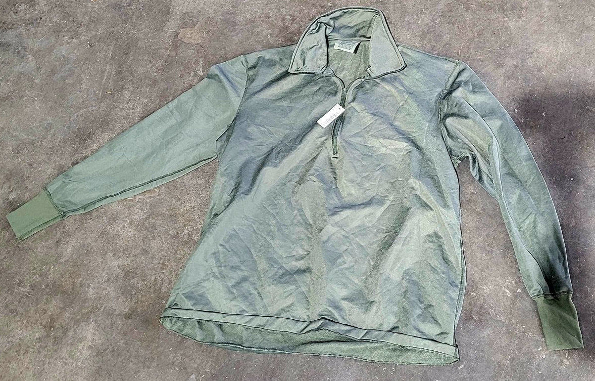 Green jacket on a gray concrete surface