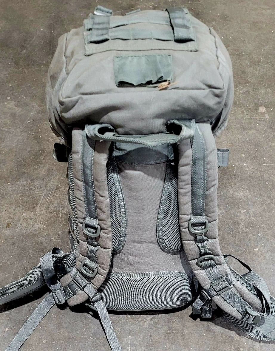 Gray backpack on a concrete surface