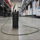 Walkie-talkie on a warehouse floor with shelves and boxes in the background