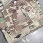 Camouflage military-style pouch on a gray surface