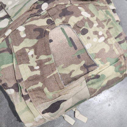 Camouflage military-style pouch on a gray surface