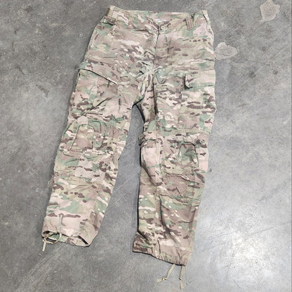 Multicam patterned pants on a concrete floor