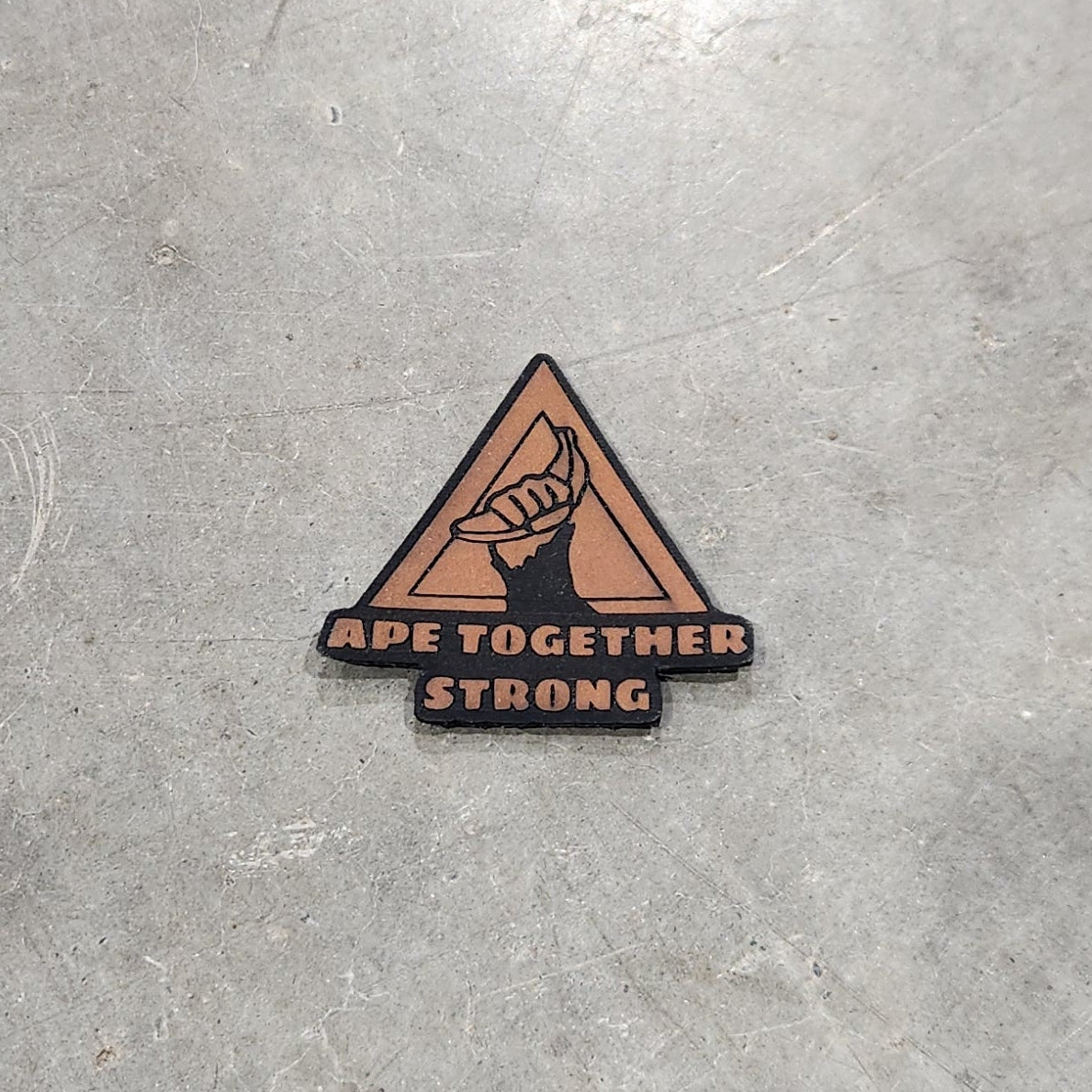 Triangular warning sign on a concrete floor
