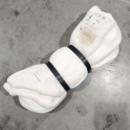 Banded socks on concrete