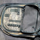 Tactical backpack with ACU camouflage pattern on a gray surface