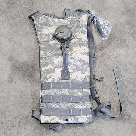 Camouflage-patterned backpack on a gray surface