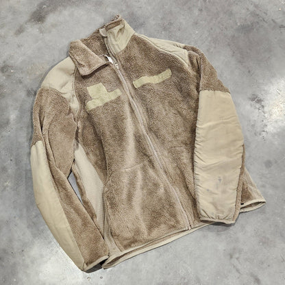Brown jacket on a gray concrete floor