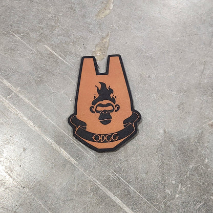 Small leather patch with a design on a gray concrete floor