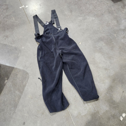 Black fleece coveralls on the concrete floor