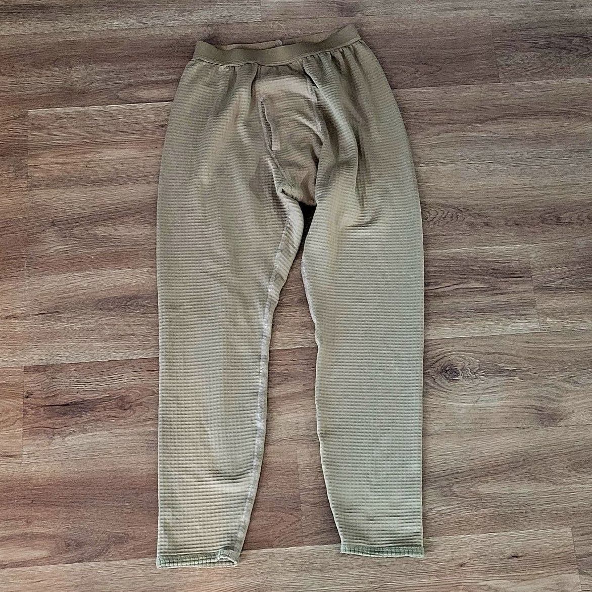 USGI Grid Fleece Pants in Tan 499 on the ground