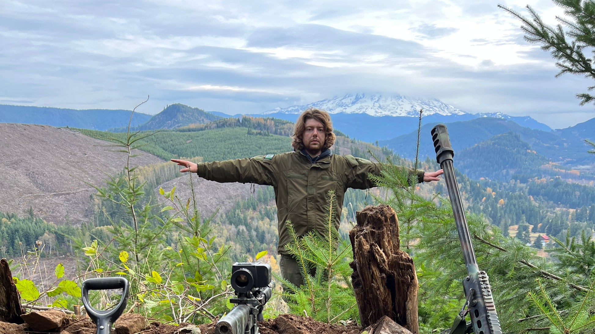 man in front of mountain asserting his dominance over the kingdom of heaven