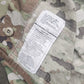 Camouflage fabric with a label on a military-style background