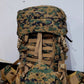 Camouflage backpack with brown straps on a white background