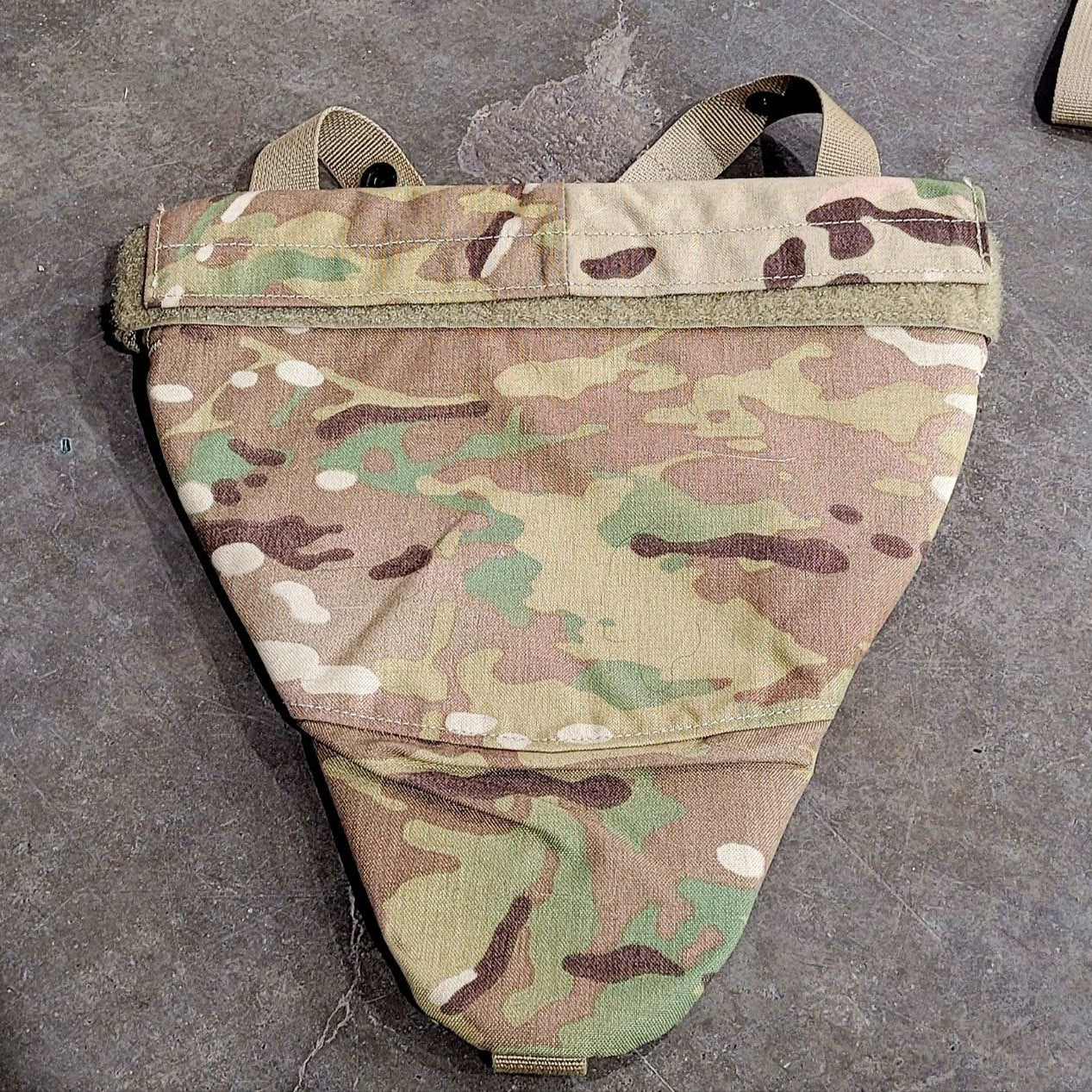 Camouflage tactical pouch on a gray surface