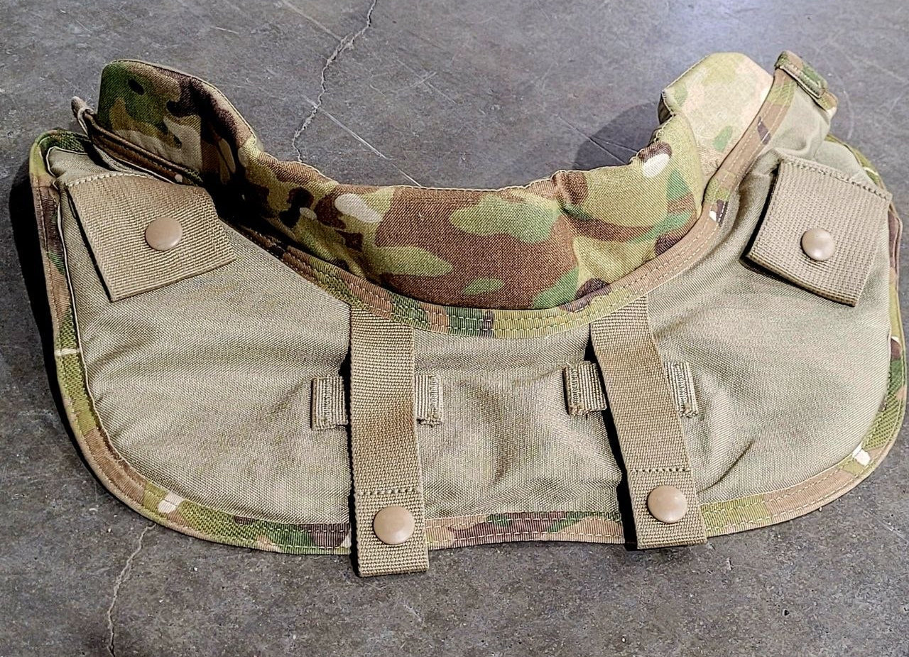 Camouflage tactical belt with multiple pouches on a gray surface