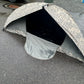 Tent deployed on gravel