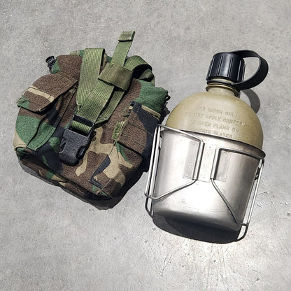 canteen and pouch on concrete surface