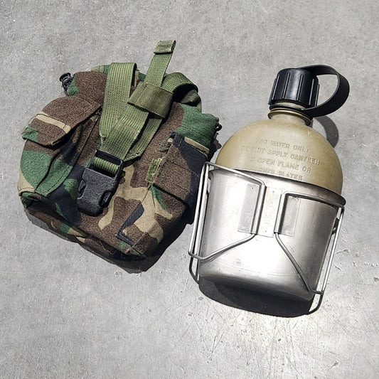 canteen and pouch on concrete surface