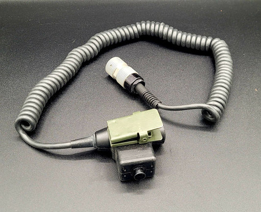 Coiled hose with connectors on a gray background