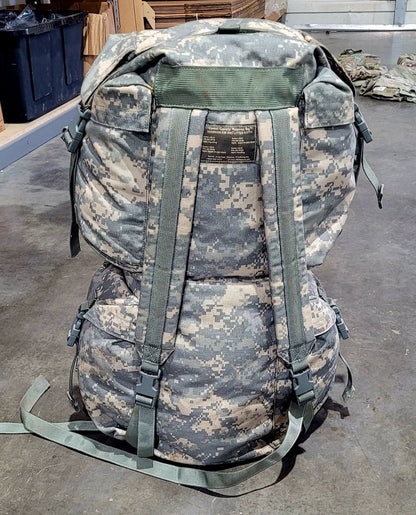 Camouflage backpack with ACU pattern on a concrete floor