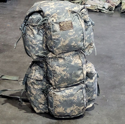 Camouflage backpack on a dark surface