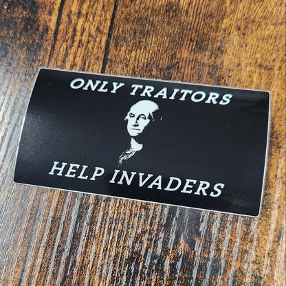 Black card with text and a portrait on a wooden surface