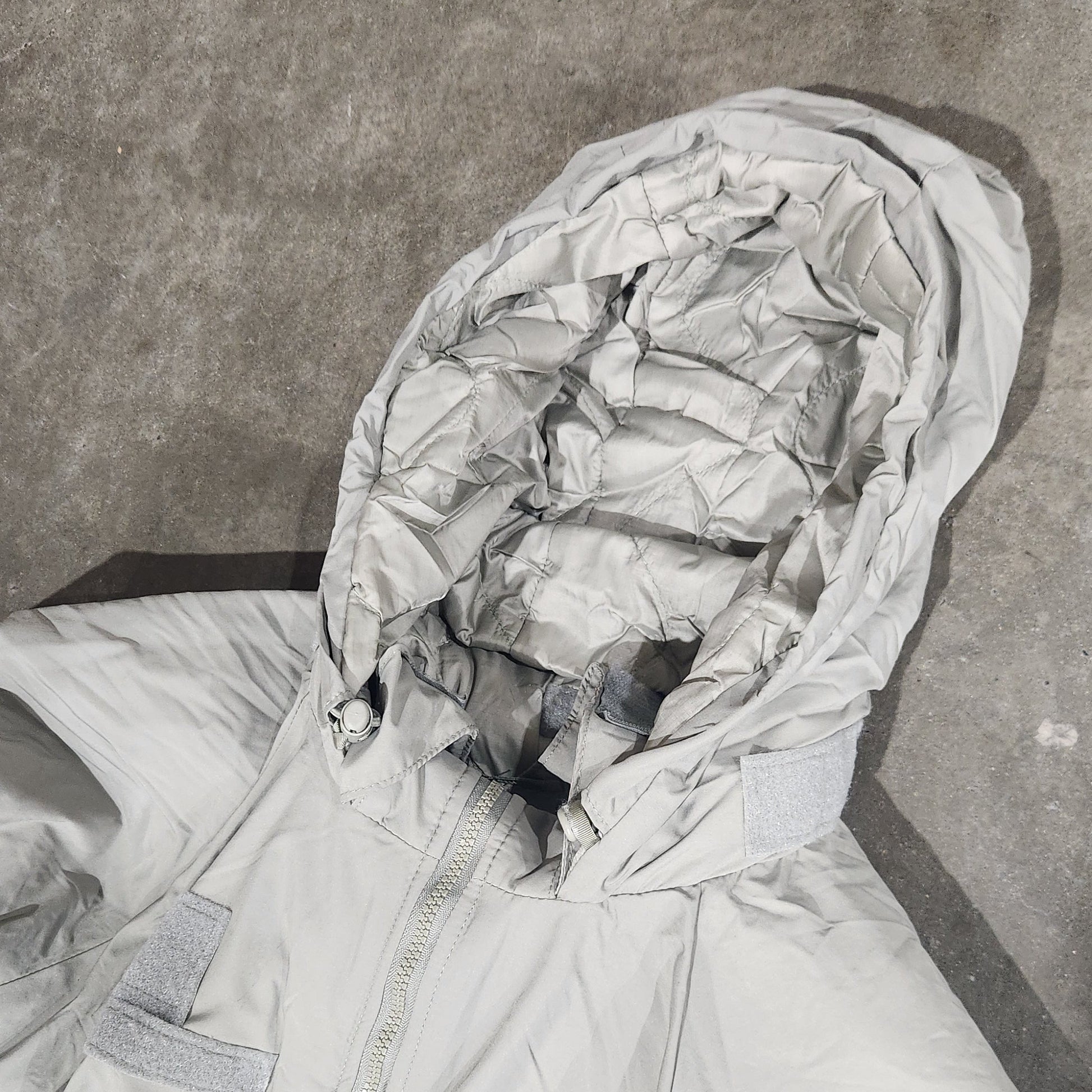 Person wearing a hooded jacket with a textured surface