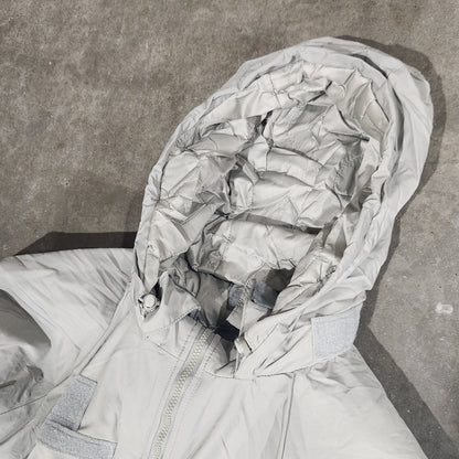 Person wearing a hooded jacket with a textured surface