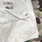 White underwear with text on a camouflage background