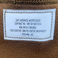 Label on a brown microfleece garment with text details.