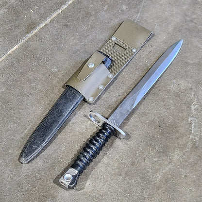 Two swords on a concrete floor