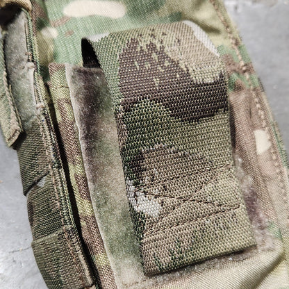 Multicam camouflage pouch with a mesh pocket on a gray background