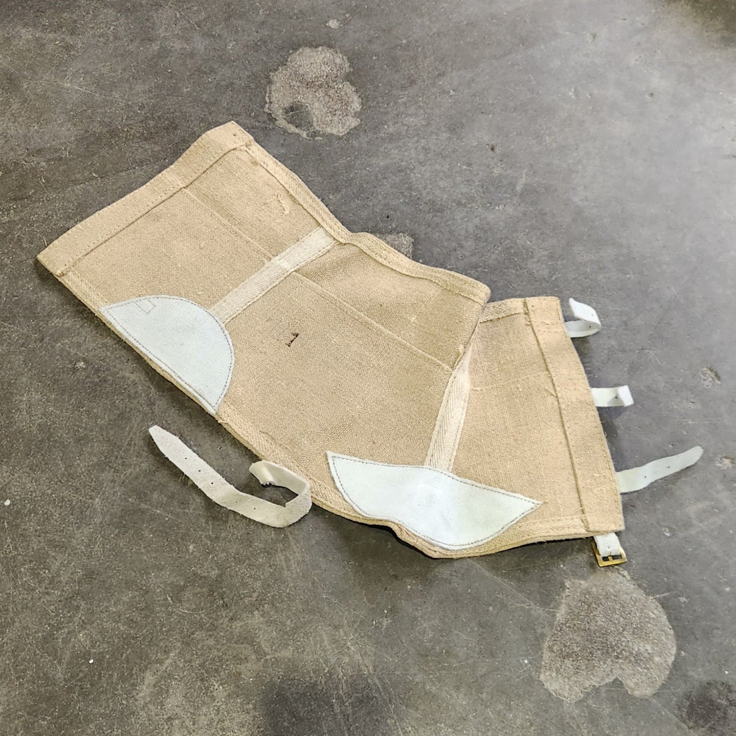 Small pouch with white accents on a textured surface