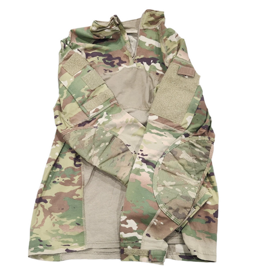 Camouflage tactical combat shirt on a gray surface