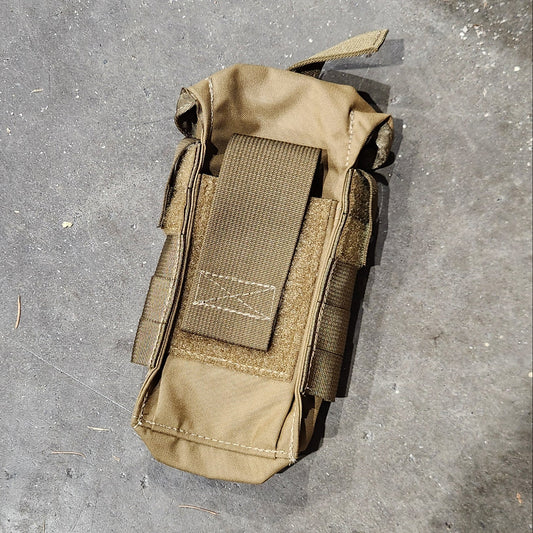 Tan tactical pouch on a concrete floor