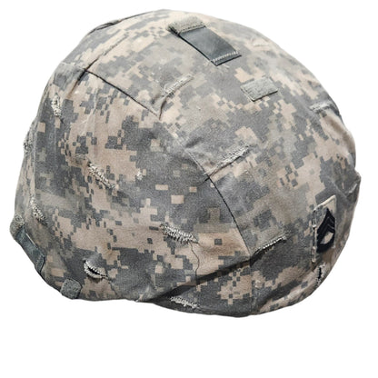 Camouflage helmet on a concrete floor