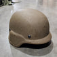Brown helmet on a concrete floor with a blurred background