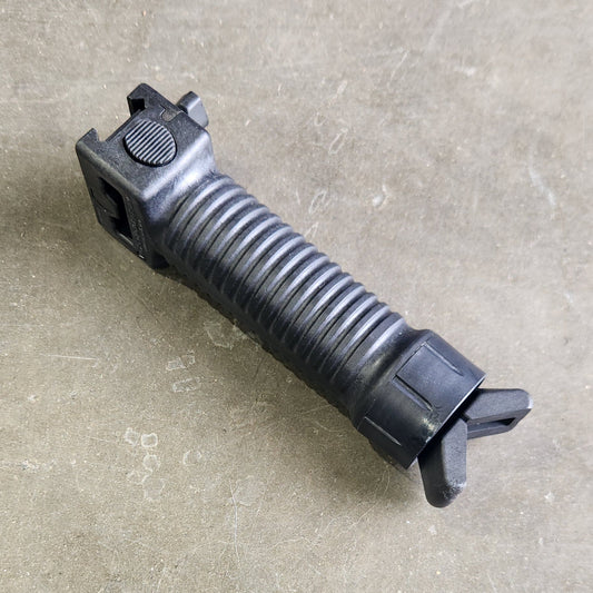 Black tactical grip on a concrete surface