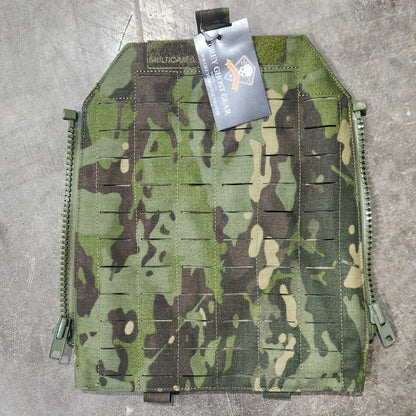 Camouflage pouch on a concrete surface with a visible brand tag.