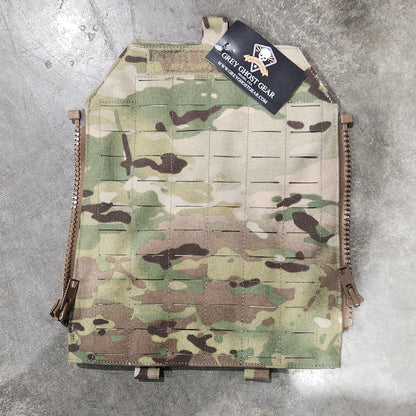 Multicam-patterned tactical plate carrier on a concrete floor