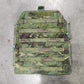 Camouflage-patterned tactical vest on a concrete floor
