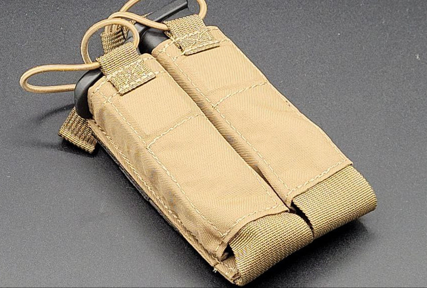 Tan tactical magazine pouch on a gray background